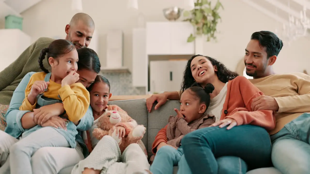 Happy big family on sofa and in living room