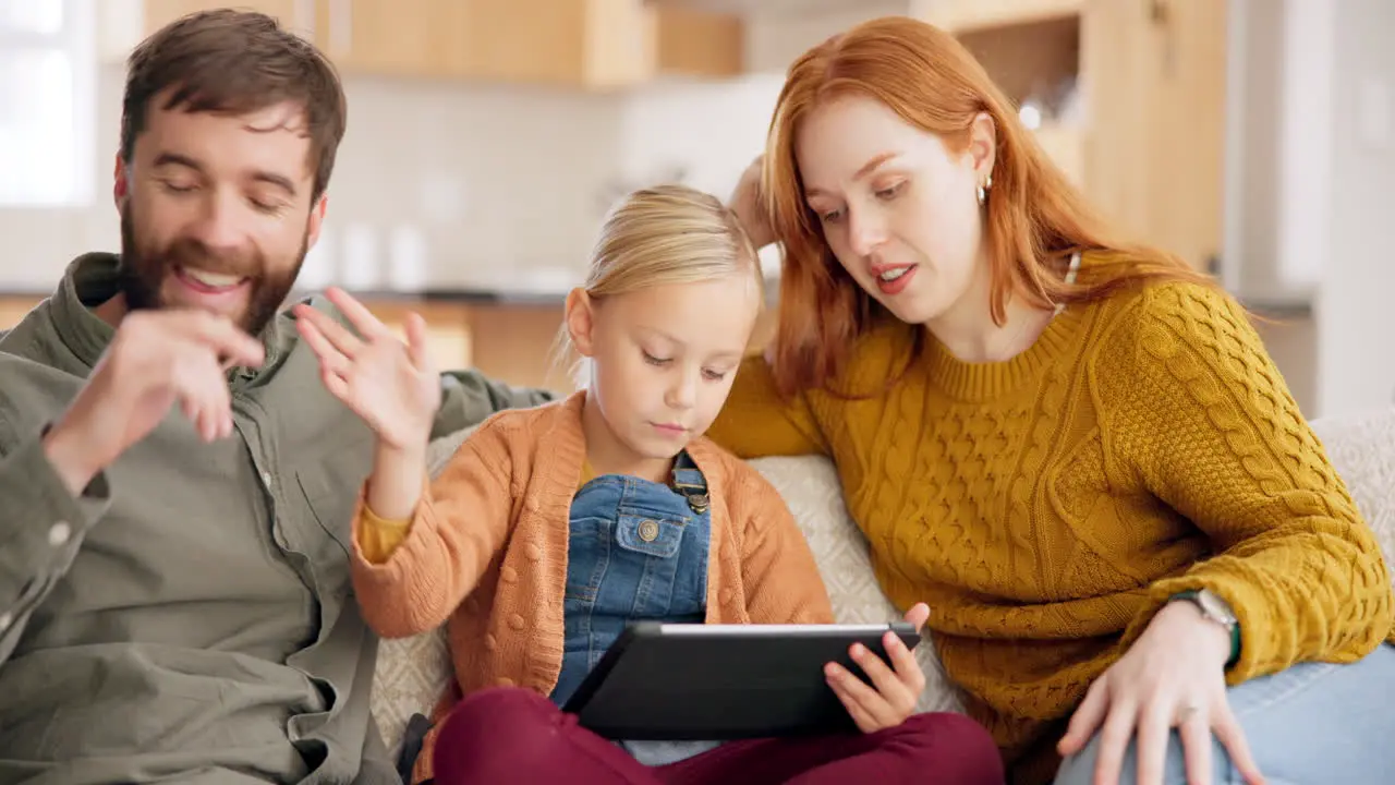 Parents child and tablet in family home