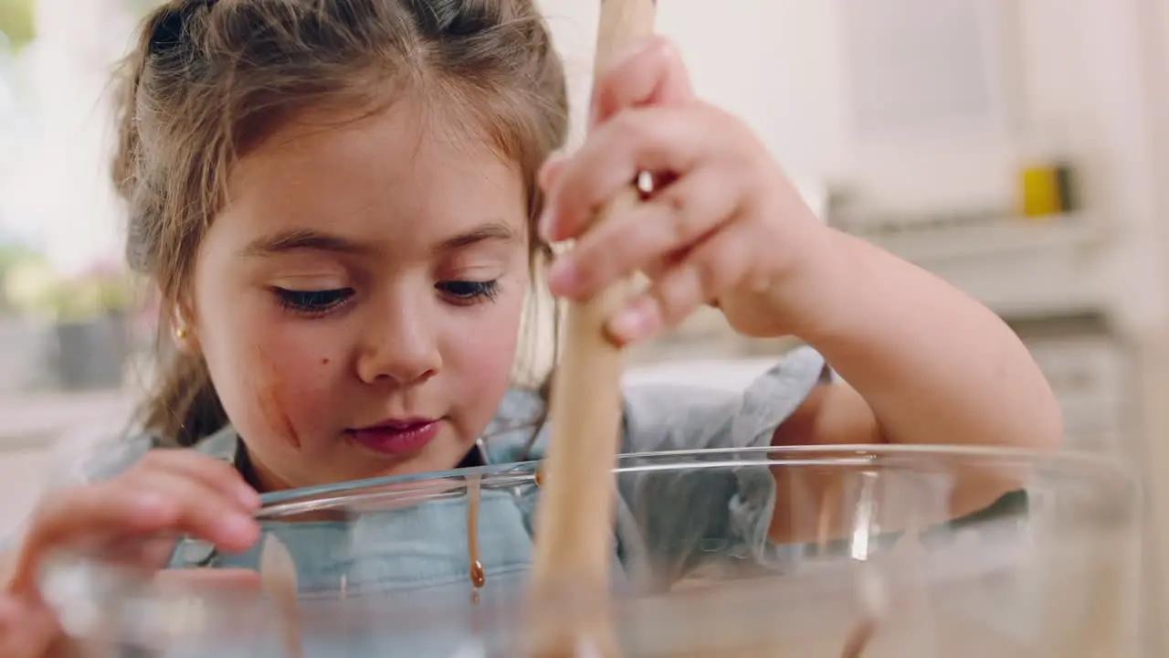 Young girl in kitchen baking