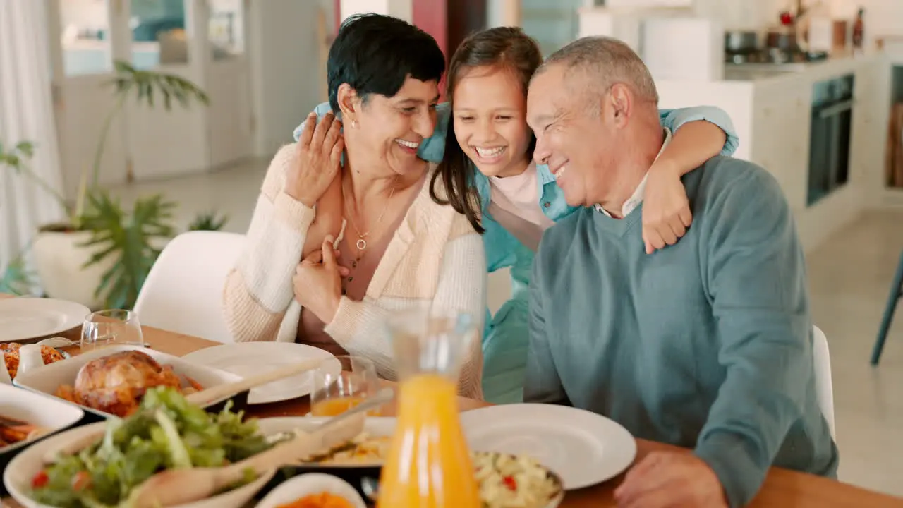 Family dinner girl hug grandparents