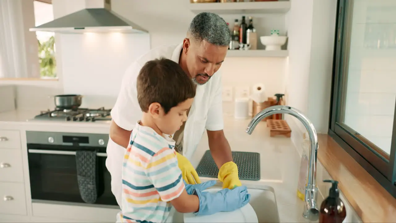 Teaching dad or child washing dishes with support