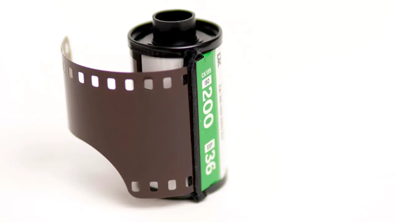 Old 35 Mm Film In Cartridge On A White Background