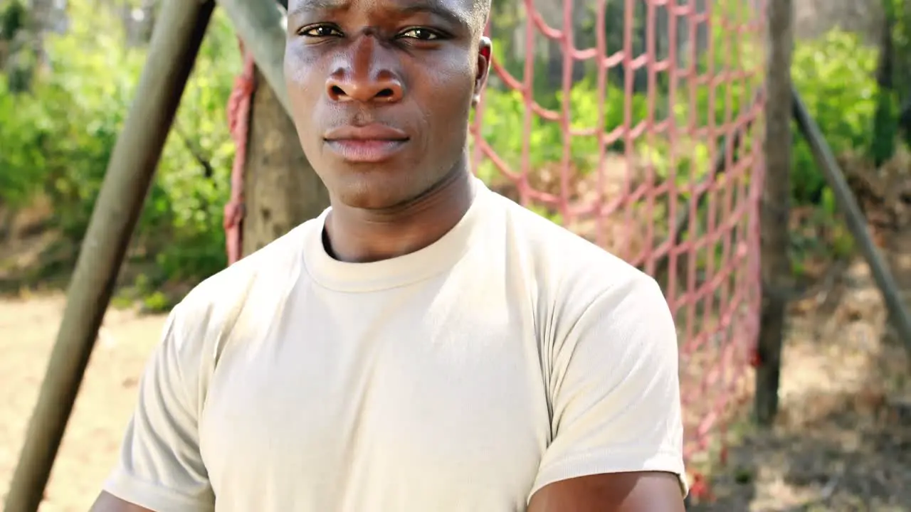 Portrait of fit man standing with arms crossed