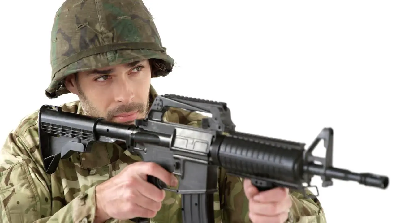 Soldier aiming rifle on white background