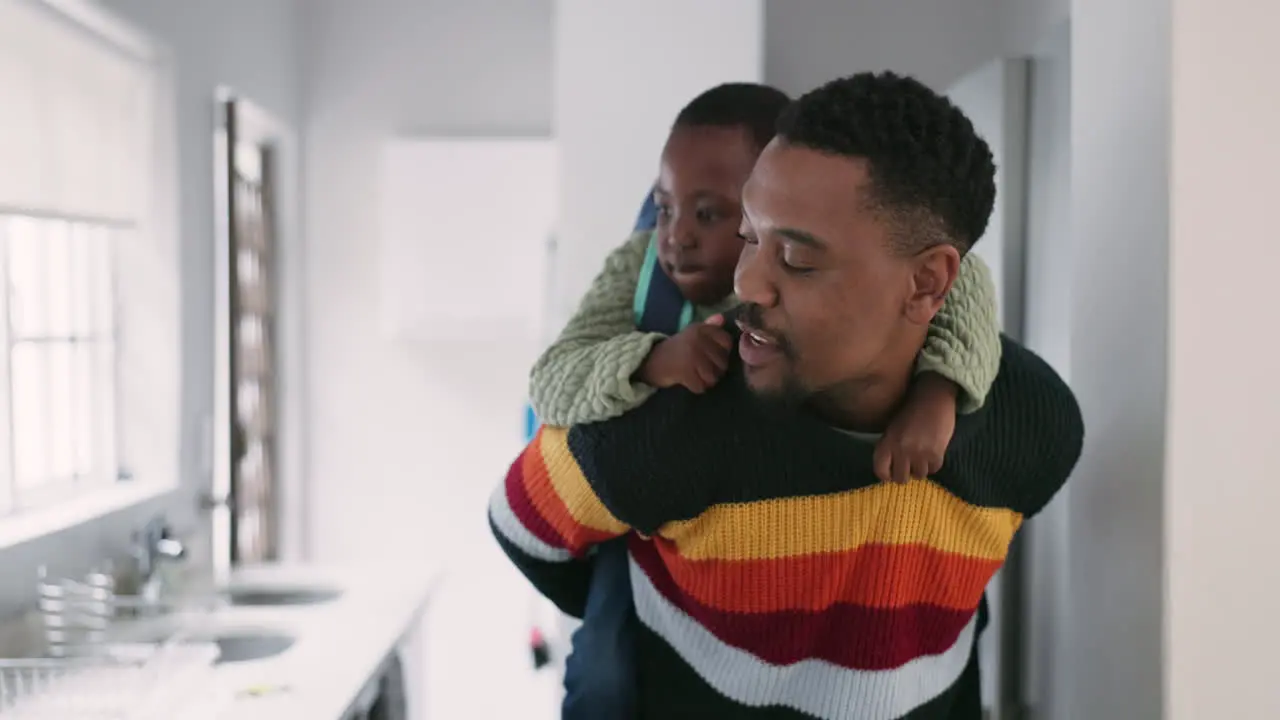 Happy black family and man with boy child