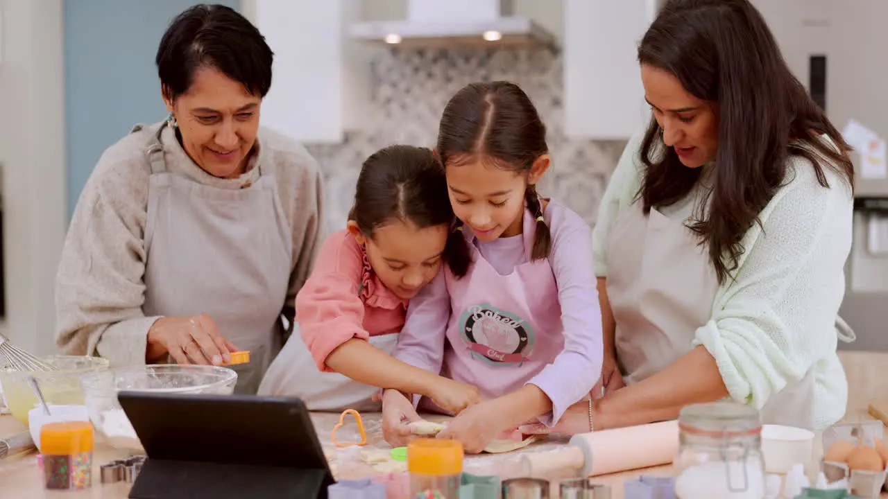 Tablet cookie cutting or happy family baking