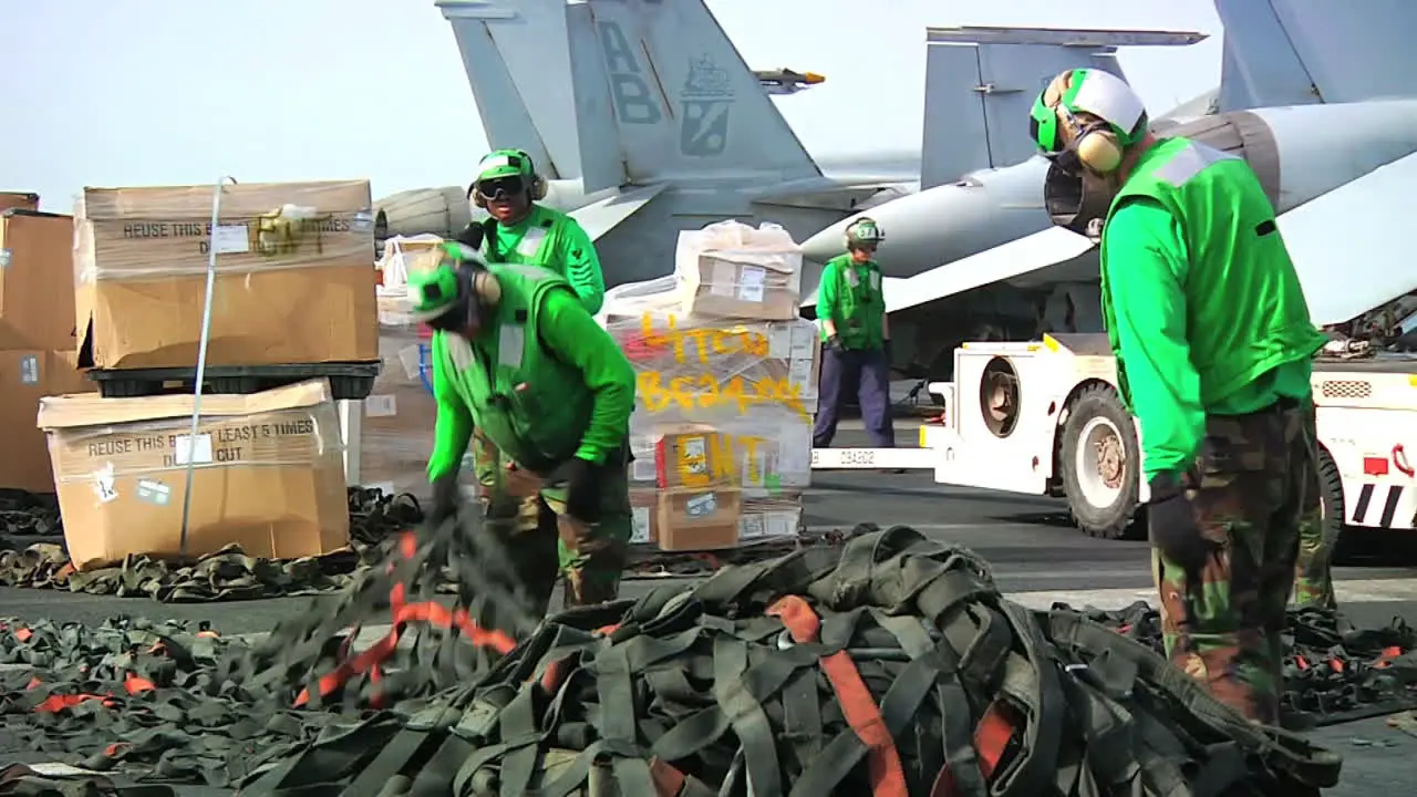 Goods Are Stacked On The Deck Of An Aircraft Carrier During A Replenishment At Sea Exercise