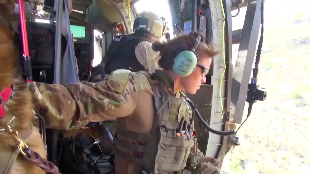 Us Border Patrol Agents Fly Over The Us Mexico Border Utilizing A K9 Canine Dog To Assist