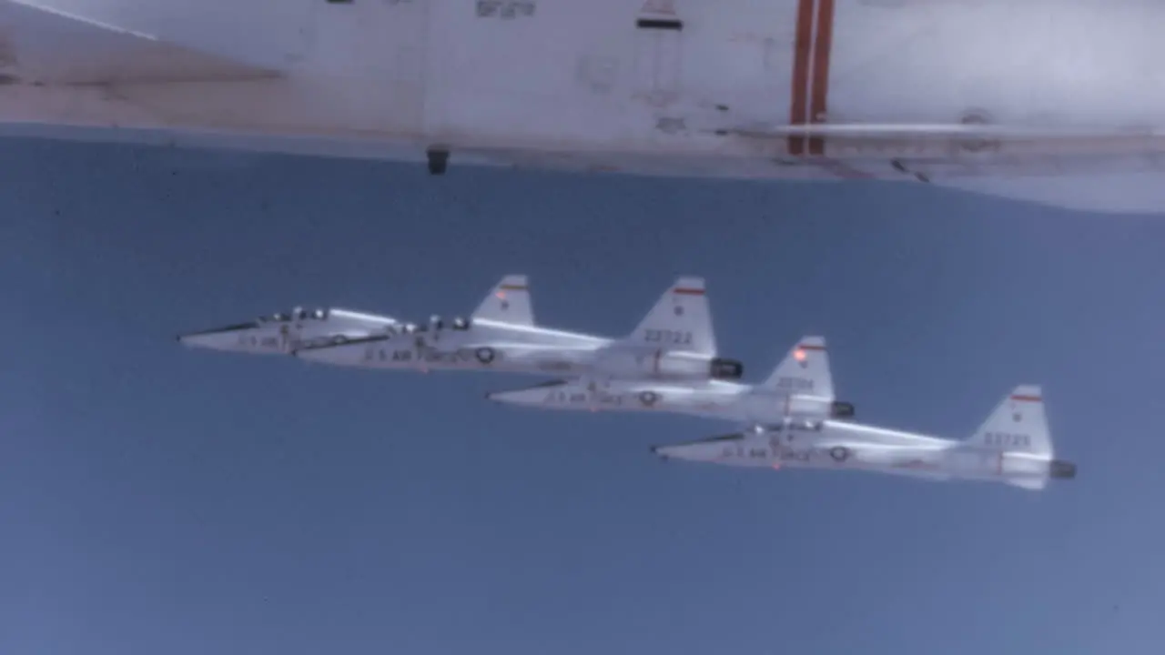 1960s US Fighter Jets in Tight Formation in Blu Sky Pilot Cockpit POV