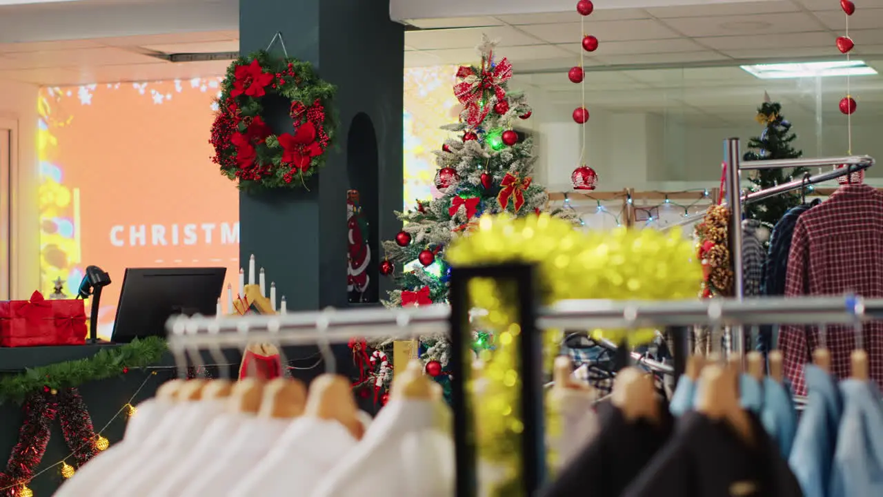 Festive Christmas decorated store with wide variety of clothing on sale and bargains for holiday shopping Mall fashion boutique adorn with xmas ornaments and formal attire racks