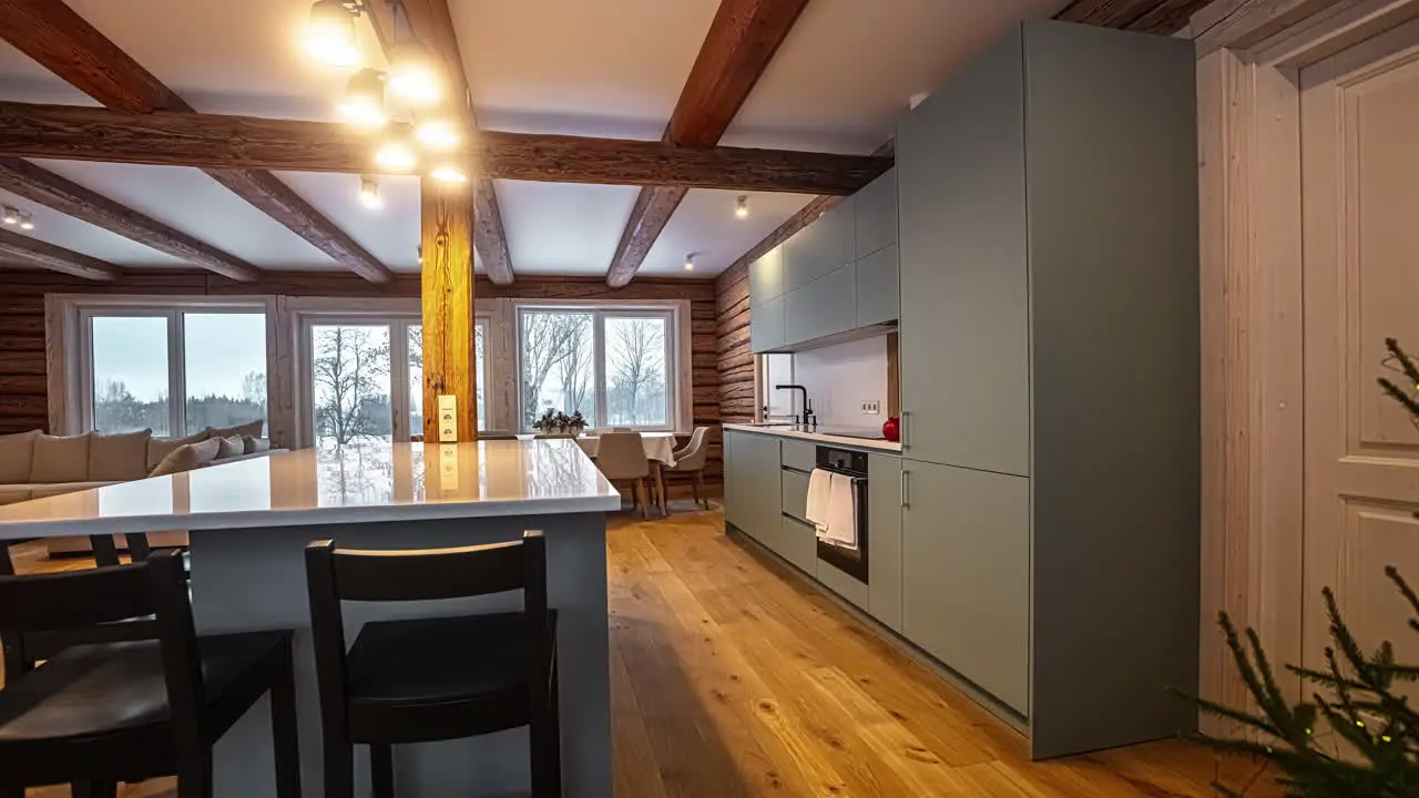 A pan shot of minimalistic kitchen in a winter cabin during christmas