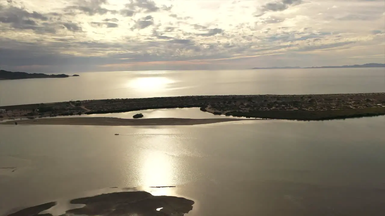 Flight over peninsula at sunset