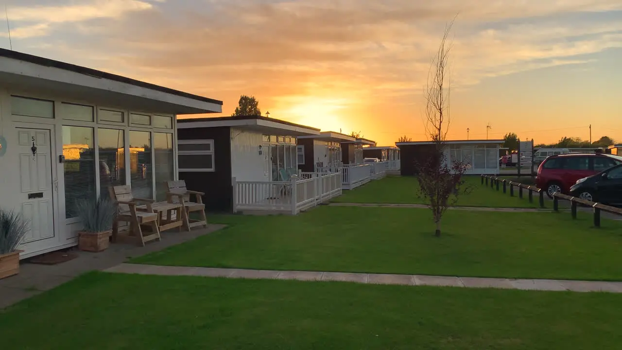 Chalets at sunset on a holiday park campsite on the coast in England