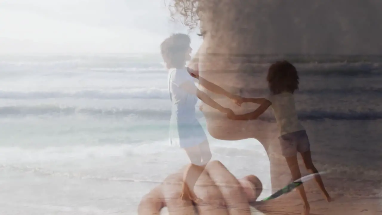 Video of thoughtful african american woman and african american mother and daughter dancing by sea