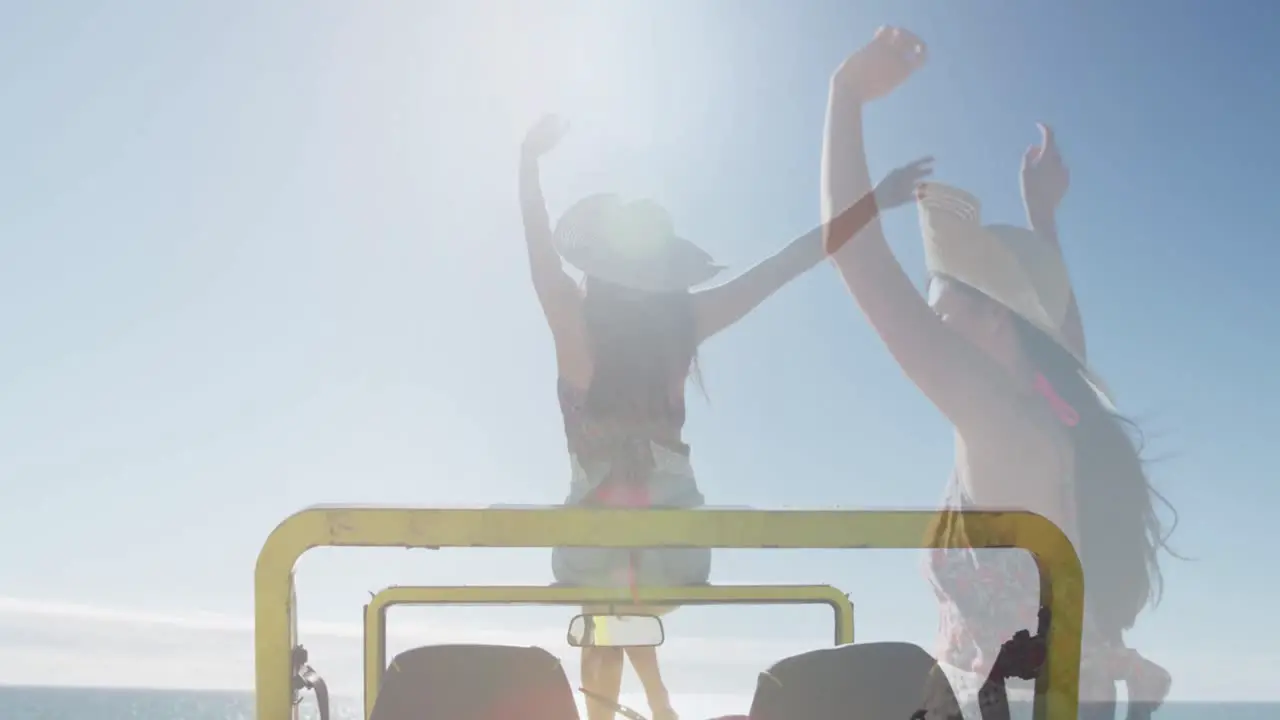 Animation of light over happy caucasian woman in car on beach