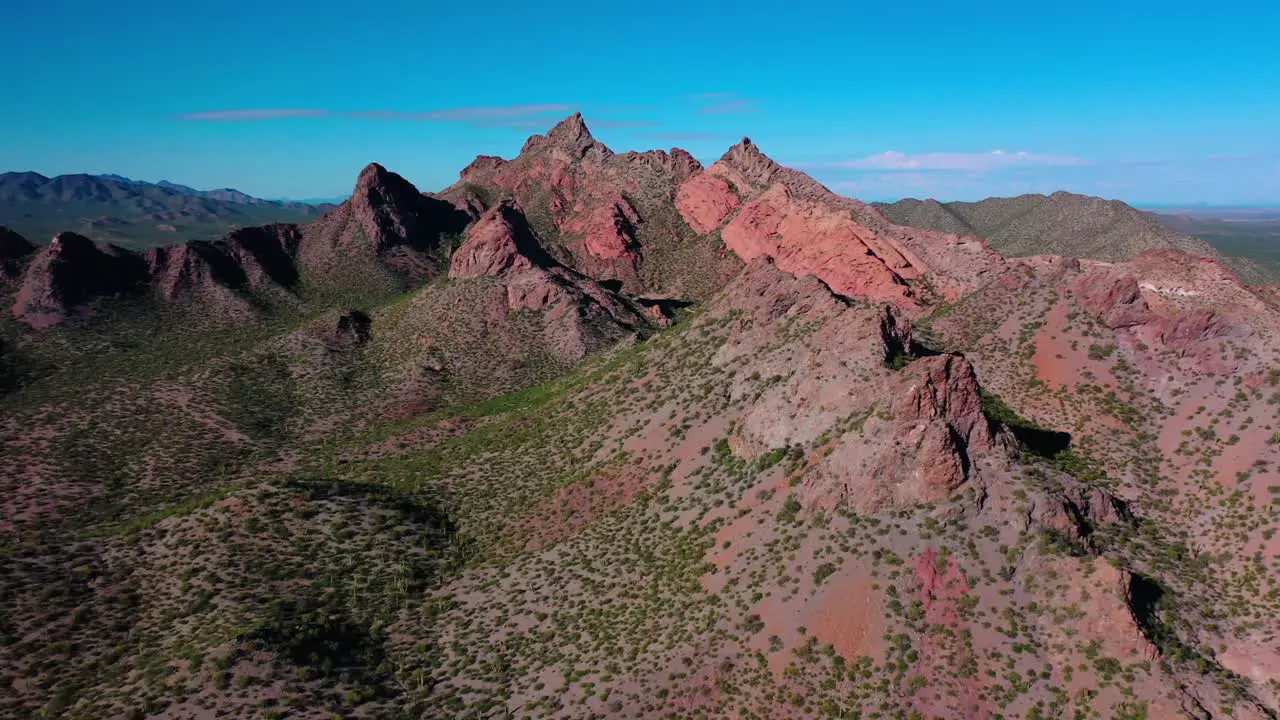 Flight to a red mountain on the desert