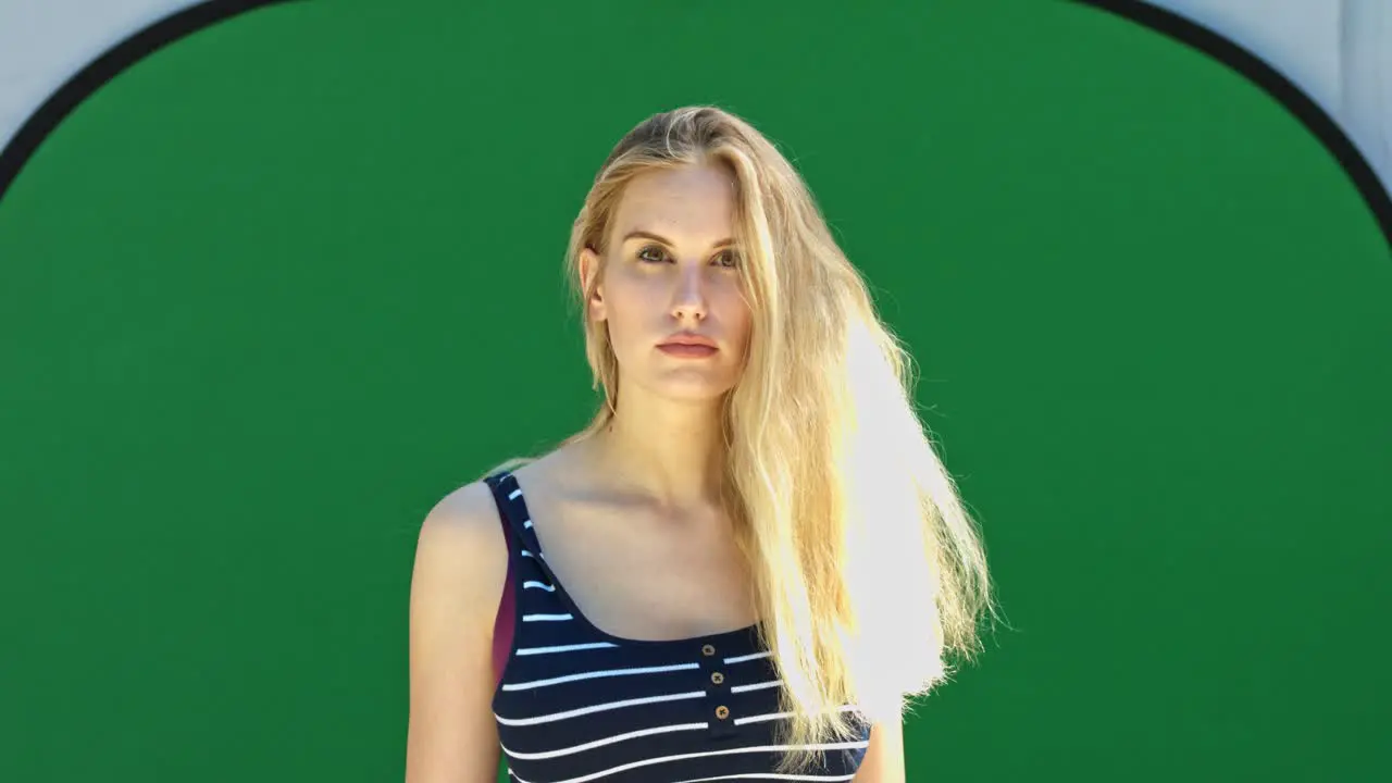 Beautiful blond woman on chroma key green background