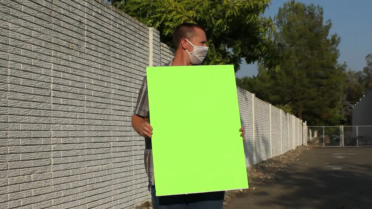 Anti COVID Protester with Mesh Mask Green Screen Sign Vertical