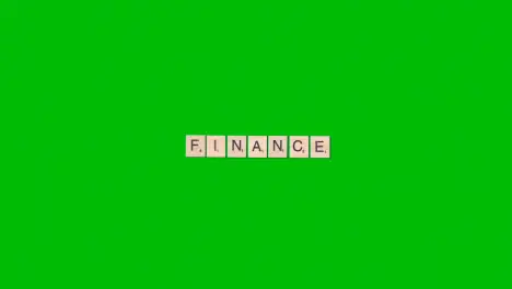 Stop Motion Business Concept Overhead Wooden Letter Tiles Forming Word Finance On Green Screen