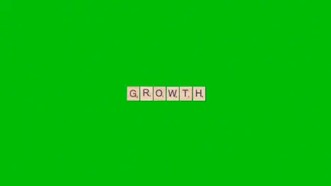 Stop Motion Business Concept Overhead Wooden Letter Tiles Forming Word Growth On Green Screen