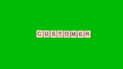 Stop Motion Business Concept Overhead Wooden Letter Tiles Forming Word Customer On Green Screen 1