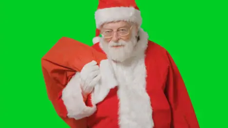 Portrait Shot of Santa Carrying Sack with Green Screen