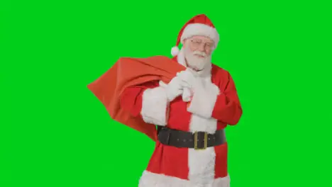 Portrait Shot of Santa Holding Sack with Green Screen