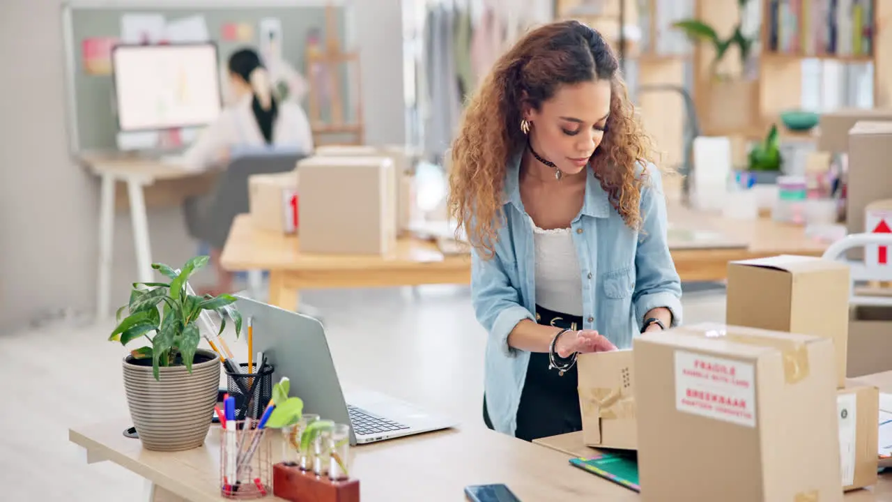 Woman boxes and laptop for logistics