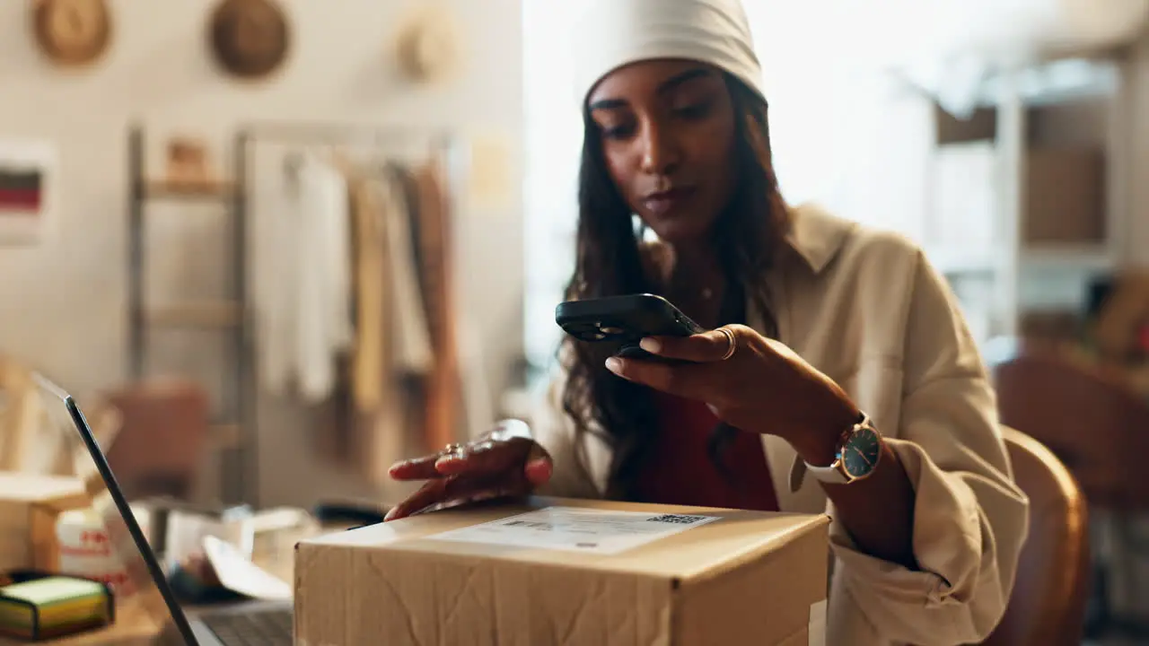 Ecommerce box and woman with phone in office