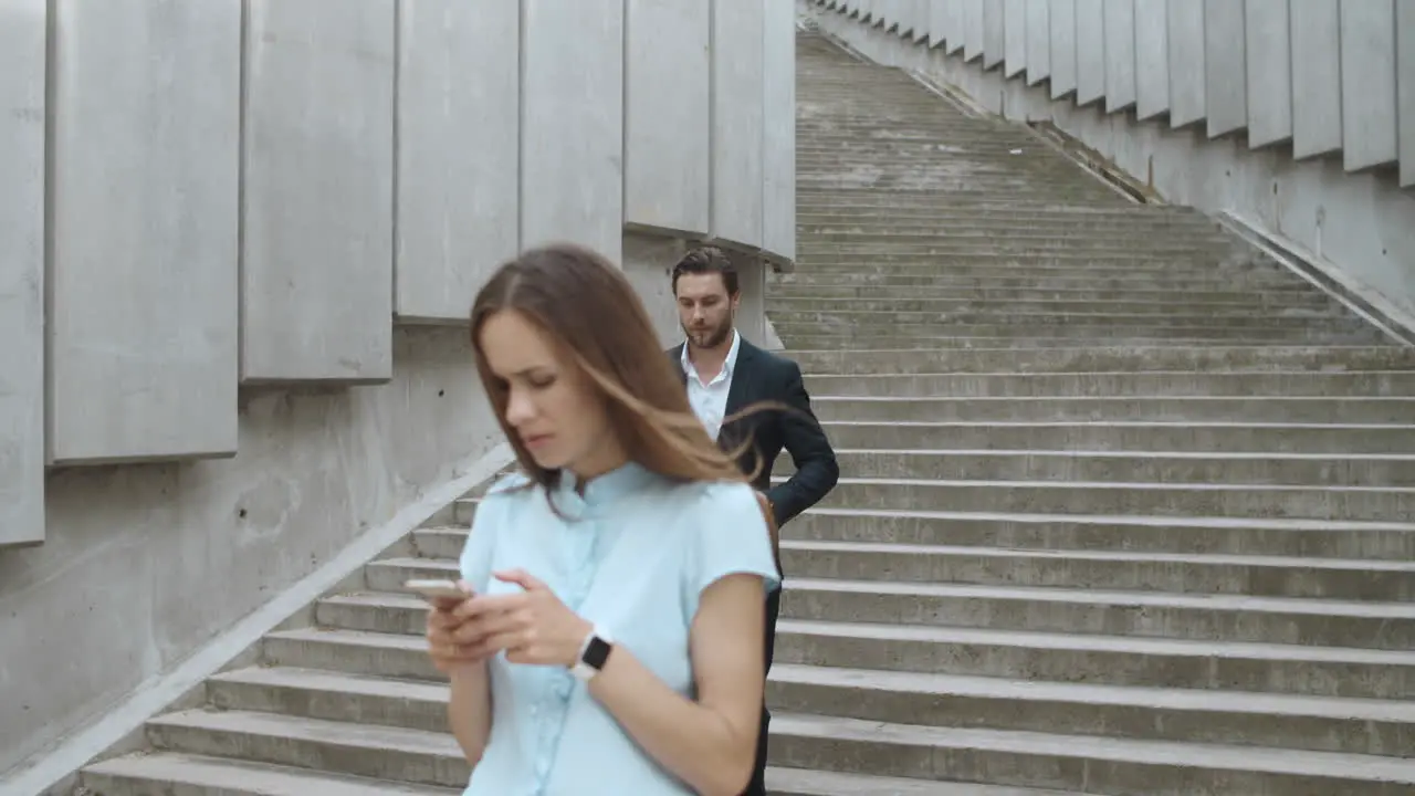 Businesswoman waiting for colleague on street Man and woman meeting in city