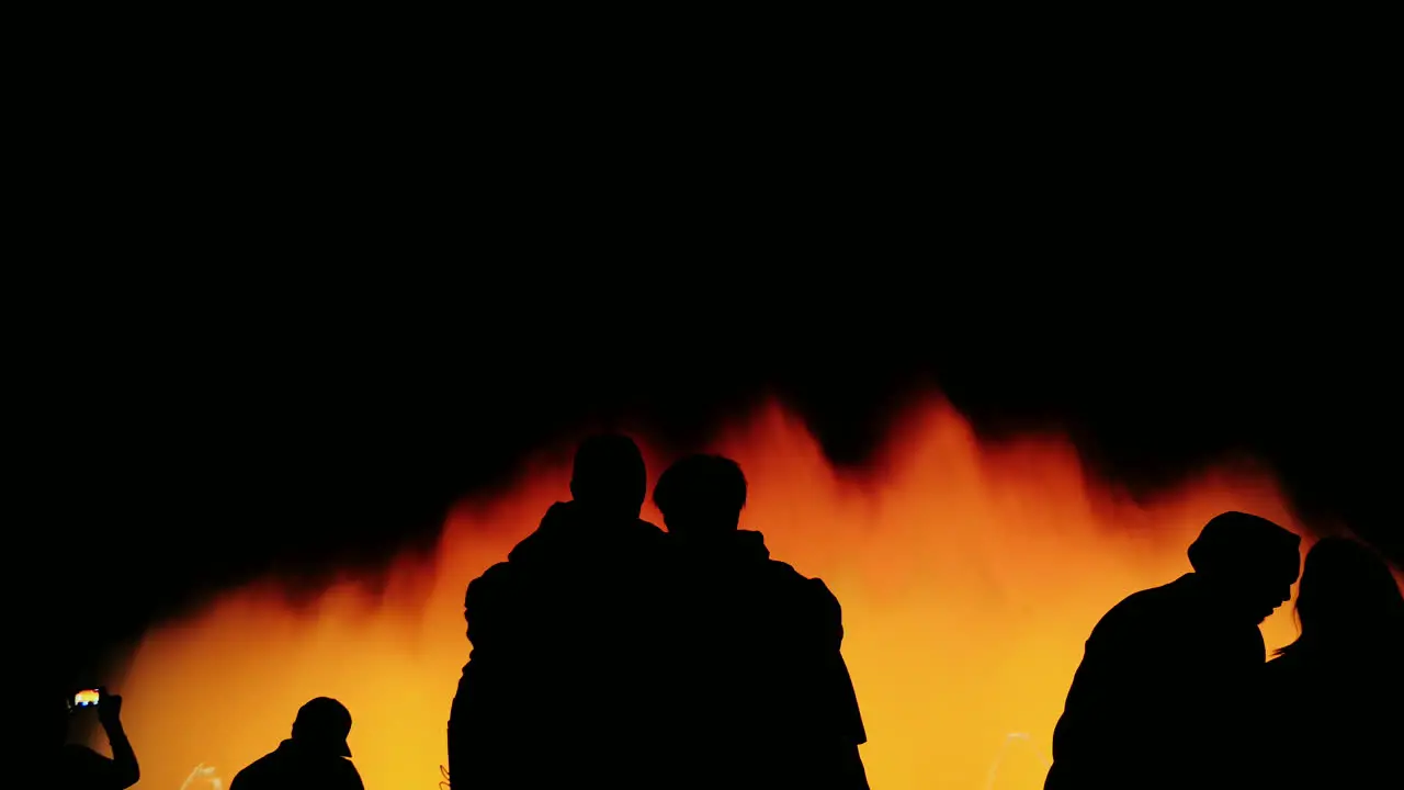 Silhouettes Of People Who Admire The High Fountain With Lights In Barcelona