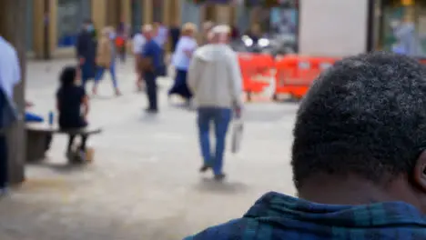 Over the Shoulder Shot of People Walking Through Bonn Square In Oxford England 01