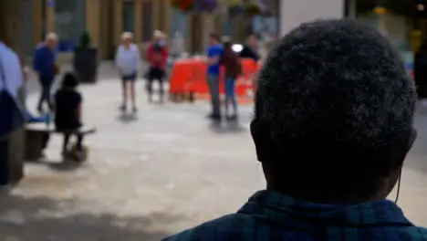 Over the Shoulder Shot of People Walking Through Bonn Square In Oxford 