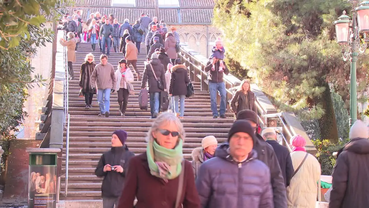 A time lapse of crowds crossing the Academia Bridge in Venice Italy 1