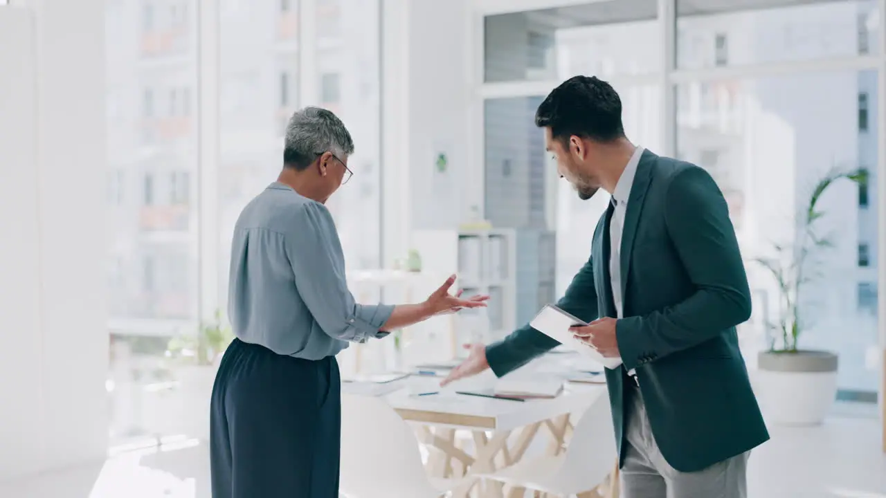 Businessman woman and handshake in office