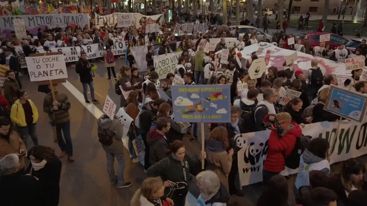 A pan shot three metres above people in a protest demonstration because climate change