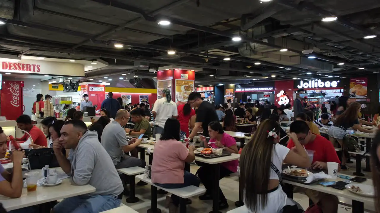 People dining indoor inside the mall of Lucky Plaza Singapore