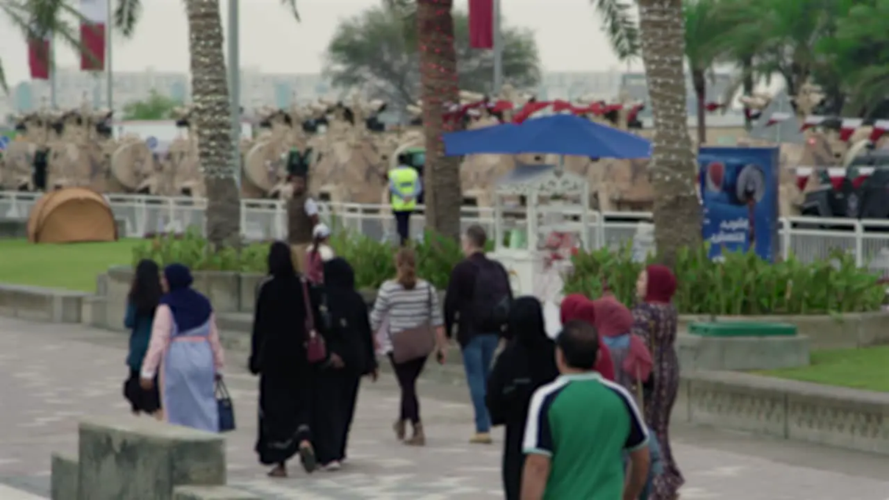 People walking in slow motion on Doha Corniche