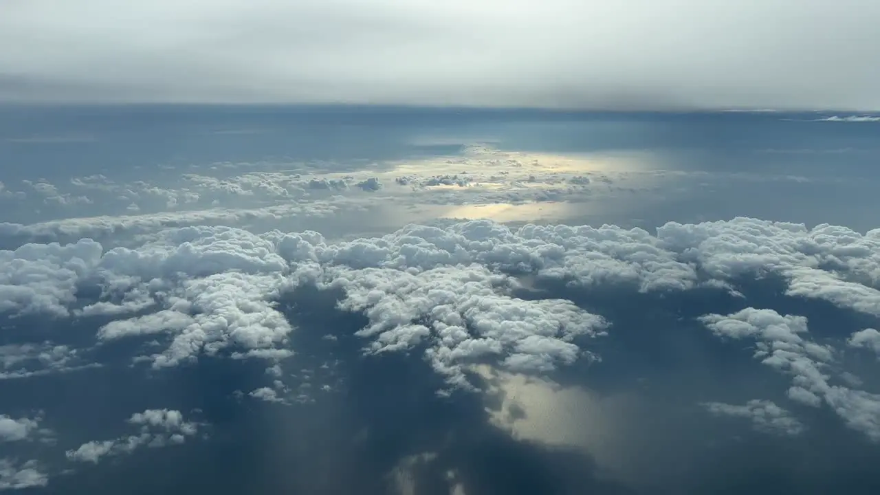 Aerial view from a cockpit of some low clouds in the sunset