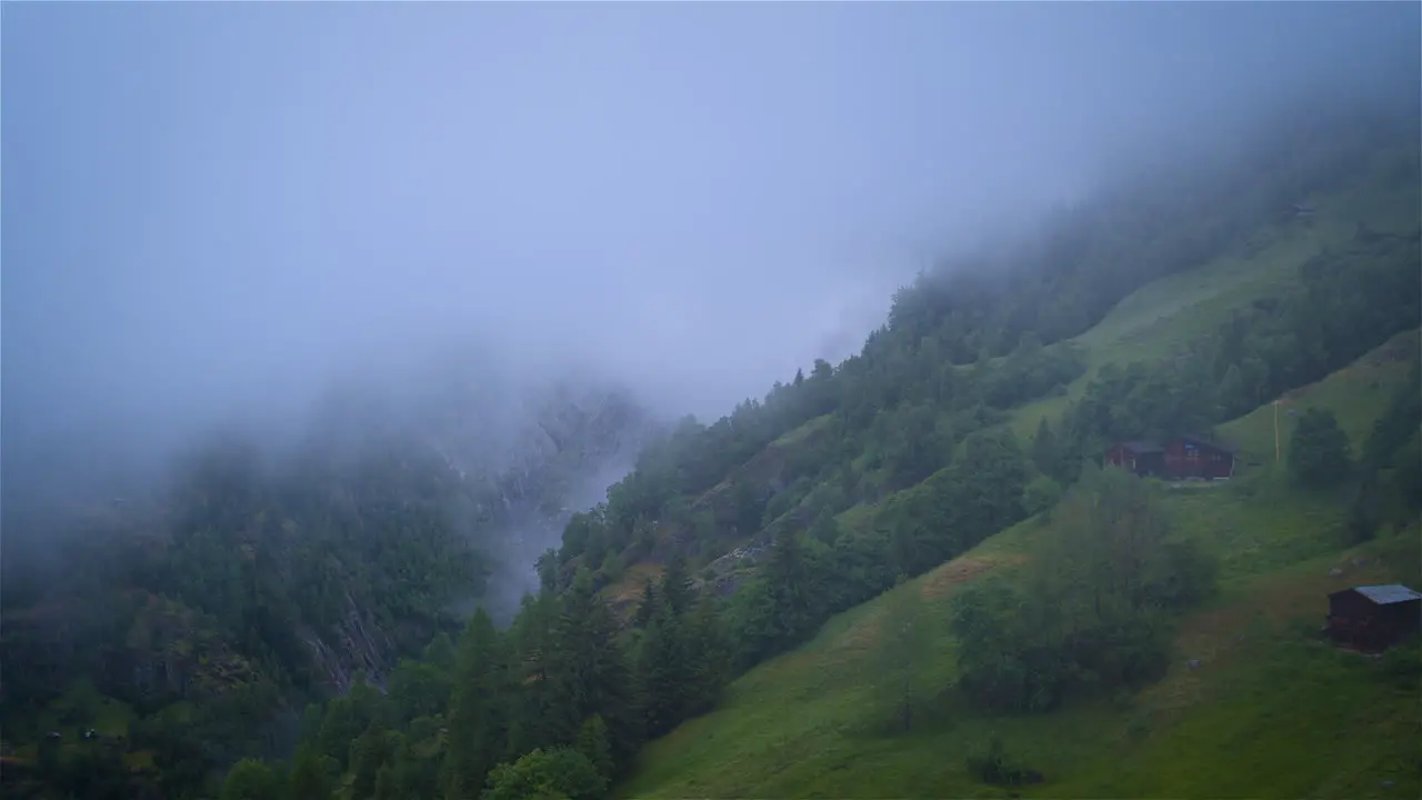 Absolutely stunning aerial shot into a misty canyon