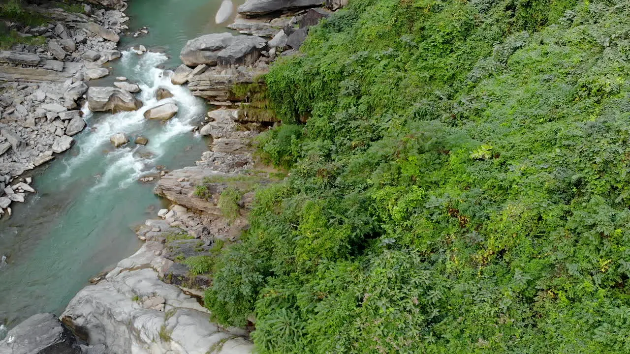 Aerial view of River flowing through a gorge in the mountains during sunset