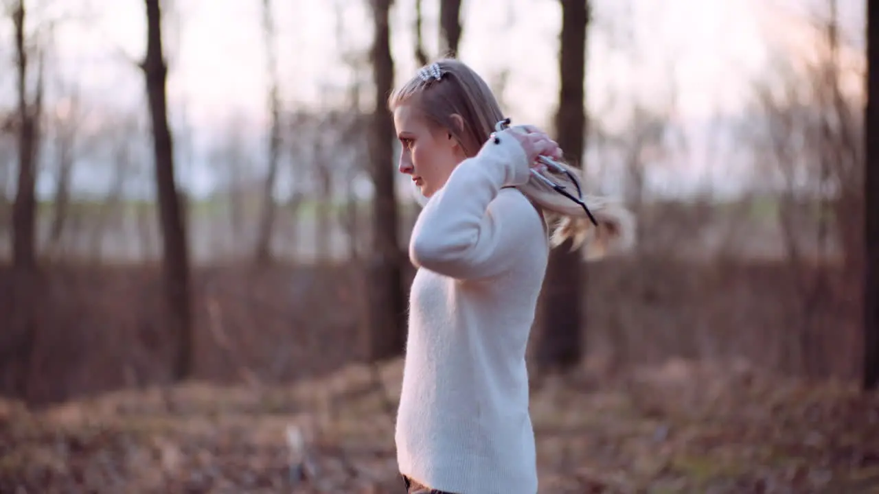 Woman Uses A Stethoscope And Examines A Tree In The Forest