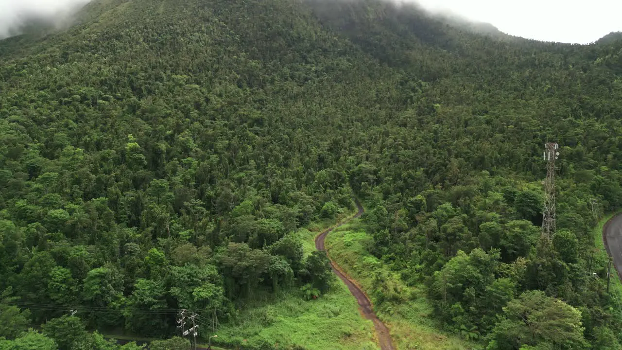 Drone Shot zoom in of tropical landscape of mountain side