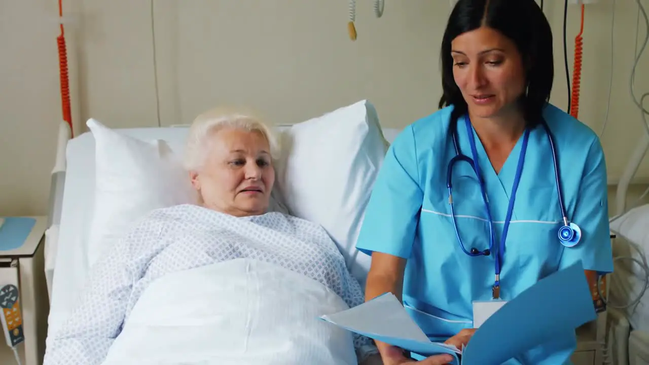 Female doctor discussing report with senior patient