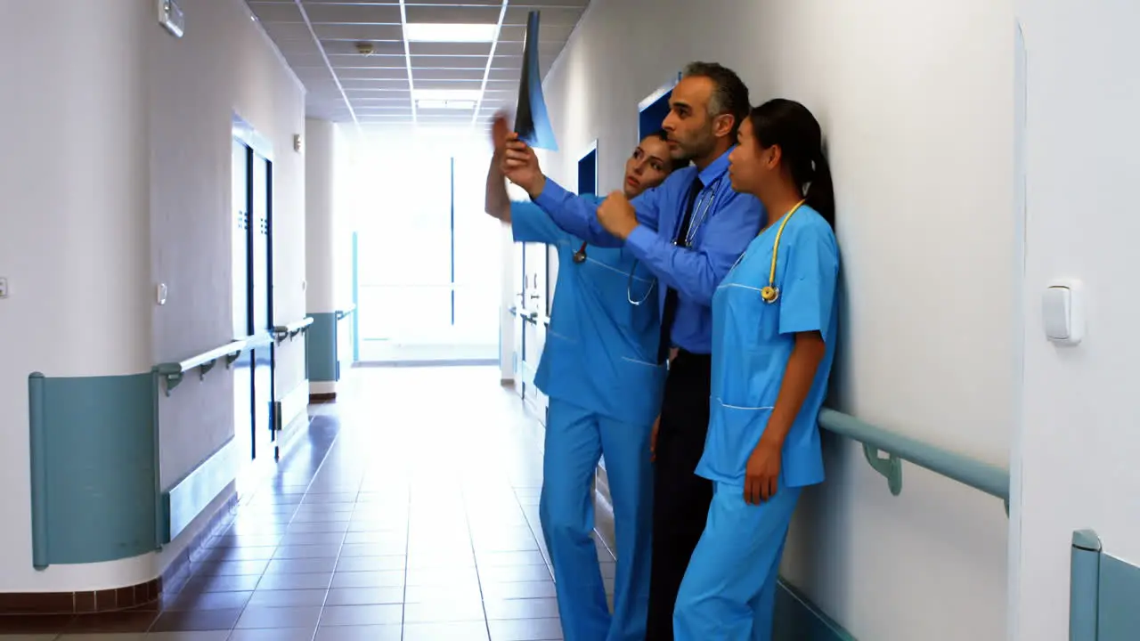 Doctor and nurses looking at x-ray