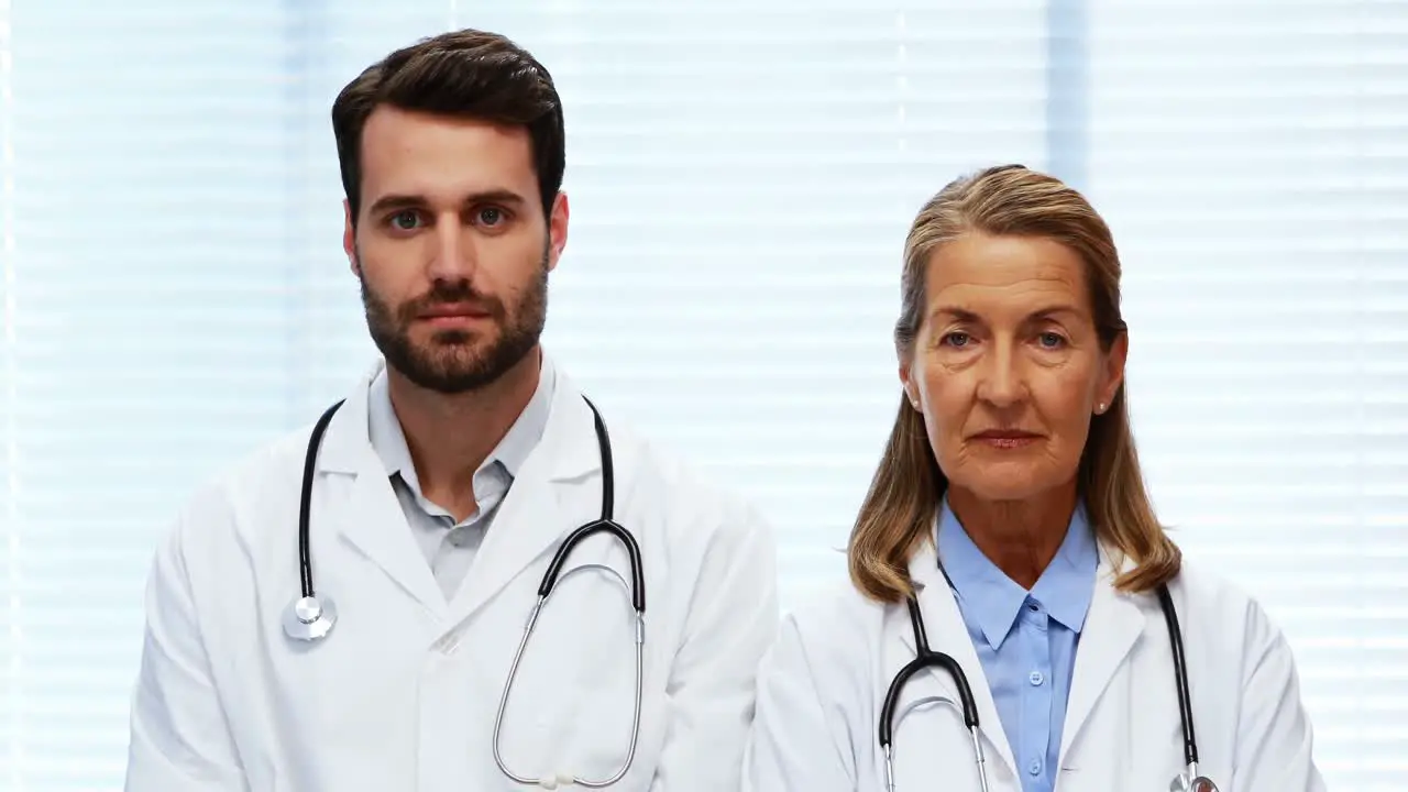 Portrait of doctors standing with arms crossed