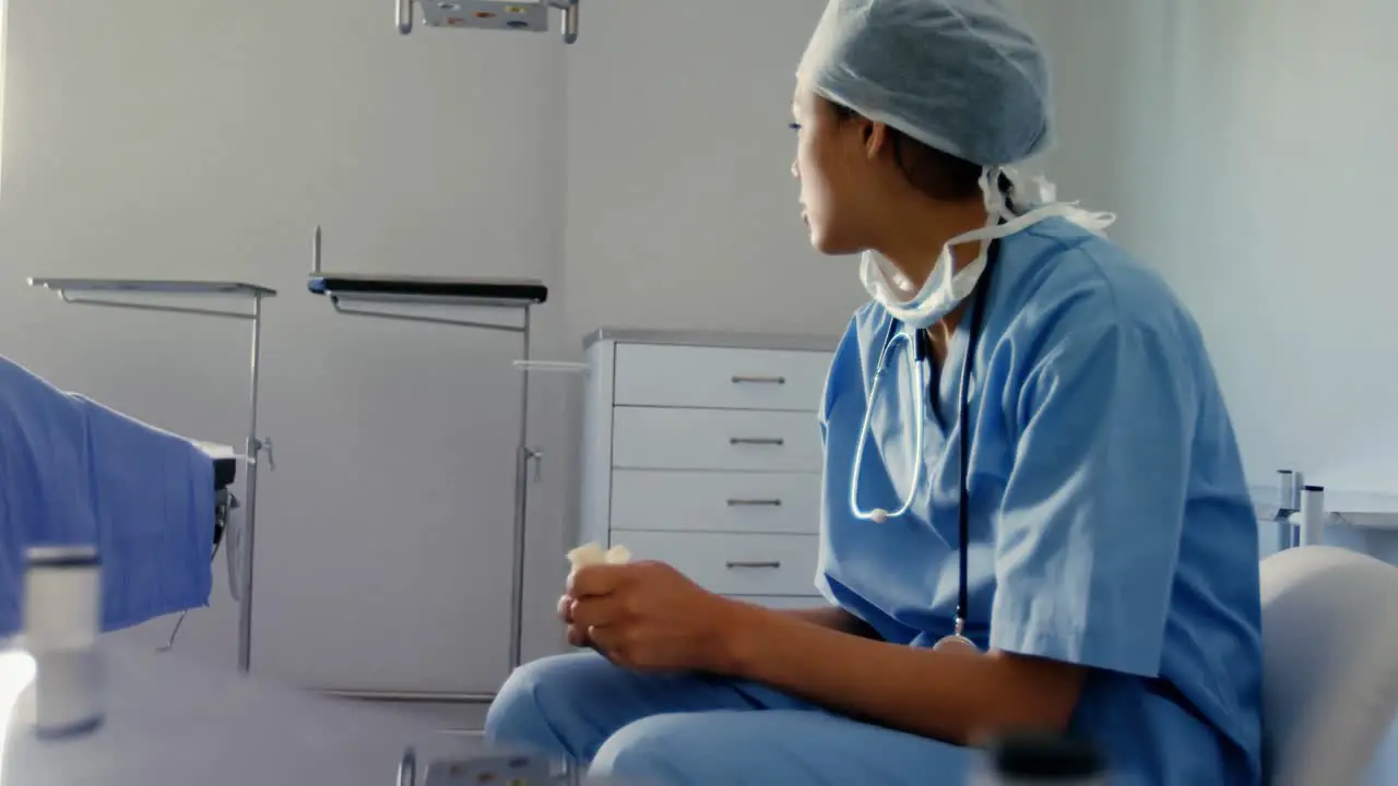 Sad female surgeon sitting on the chair