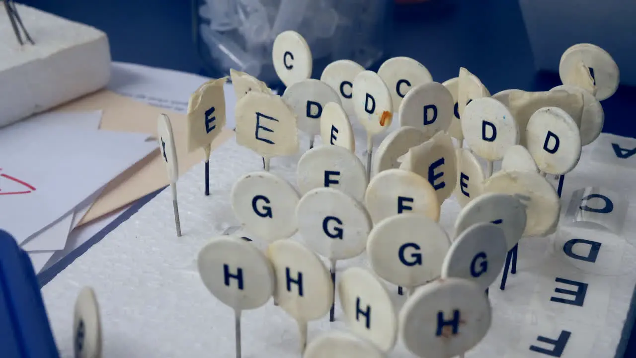 A college science laboratory desk with markers to keep track of data samples during an experiment for the students