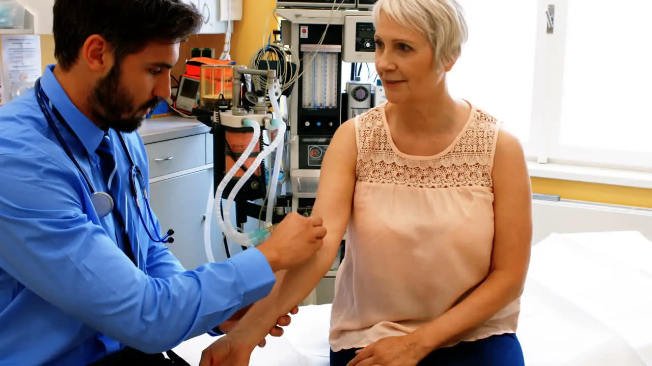 Male doctor giving an injection to a patient