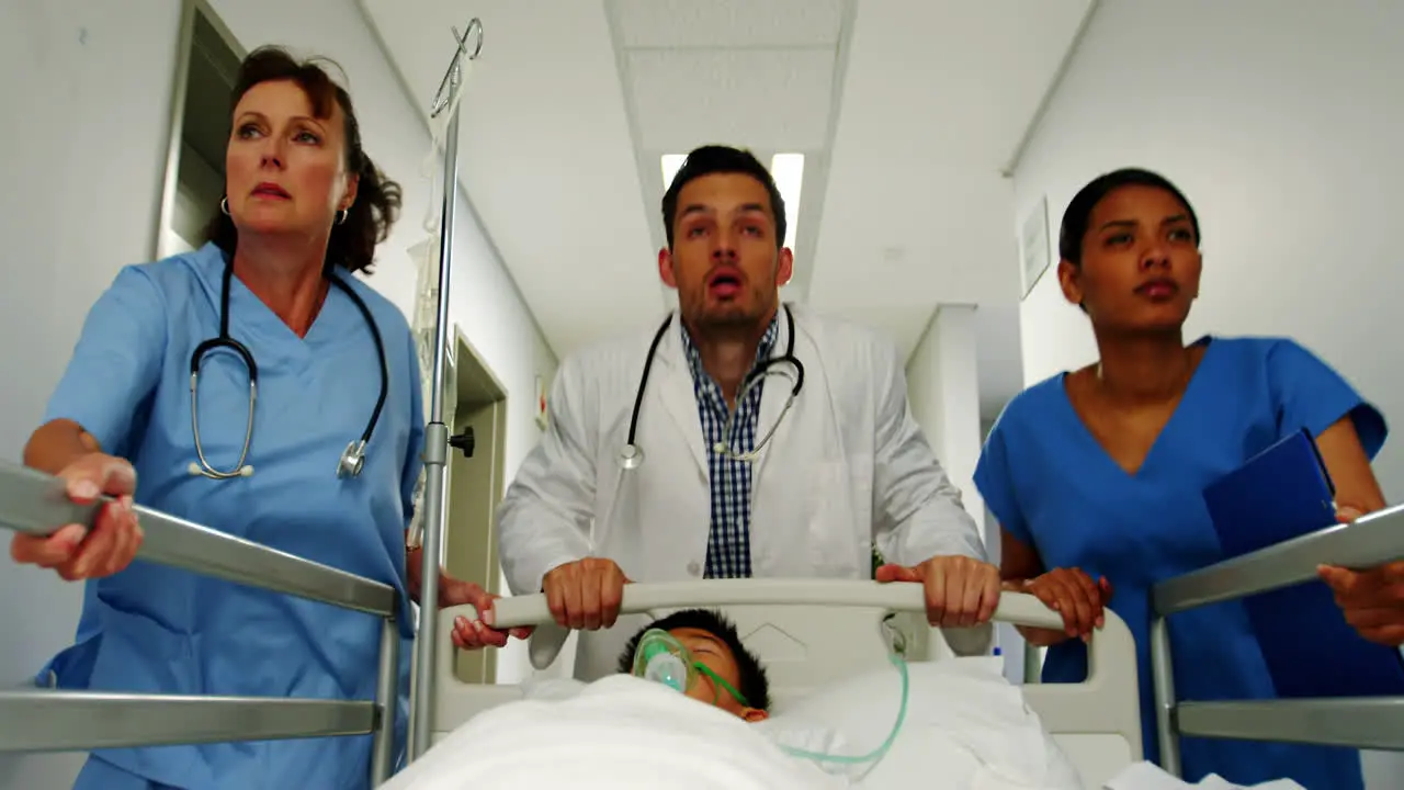 Doctor and nurse rushing a patient in emergency ward